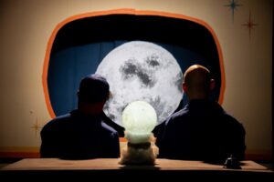 “Moonwatchers”    reviewed by Frank Meccia